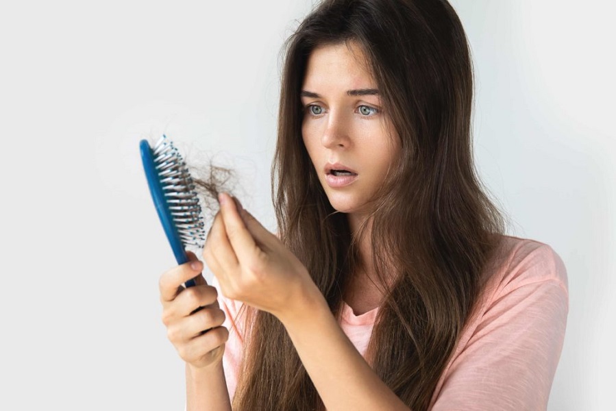 Young woman is very upset because of hair loss | Kay Dermatology in Burbank, CA