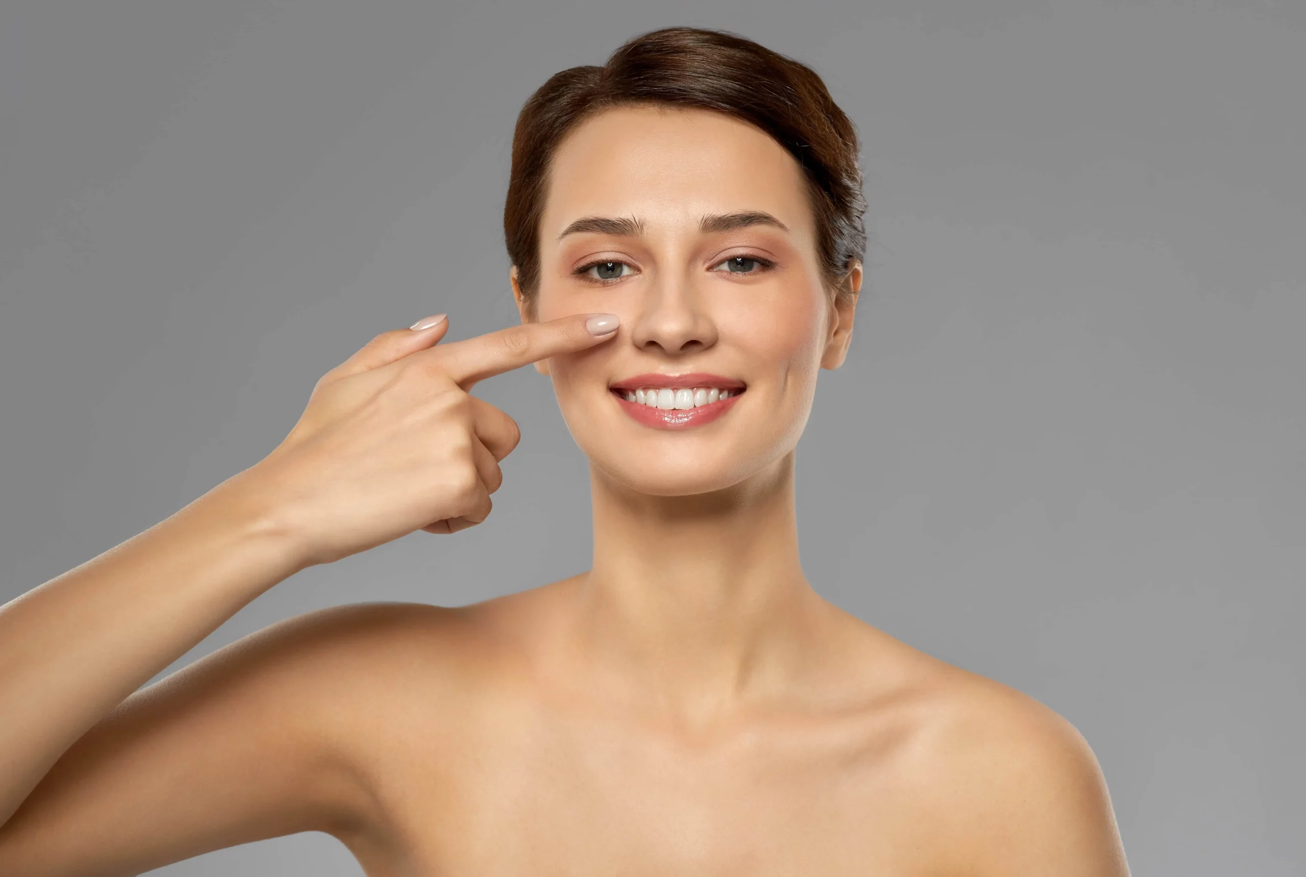 Lady pointing at her Nose | Kay Dermatology | Burbank CA