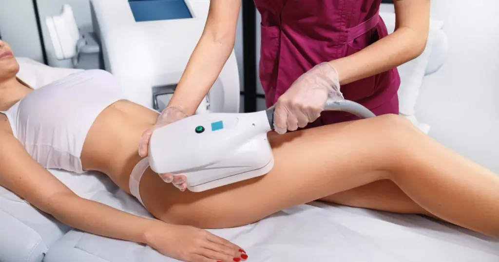 Understanding CoolSculpting: How Fat Freezing Transforms Your Shape 1 Close-up of a woman receiving a CoolSculpting procedure on her inner thigh by a practitioner in a modern clinic in Burbank, CA