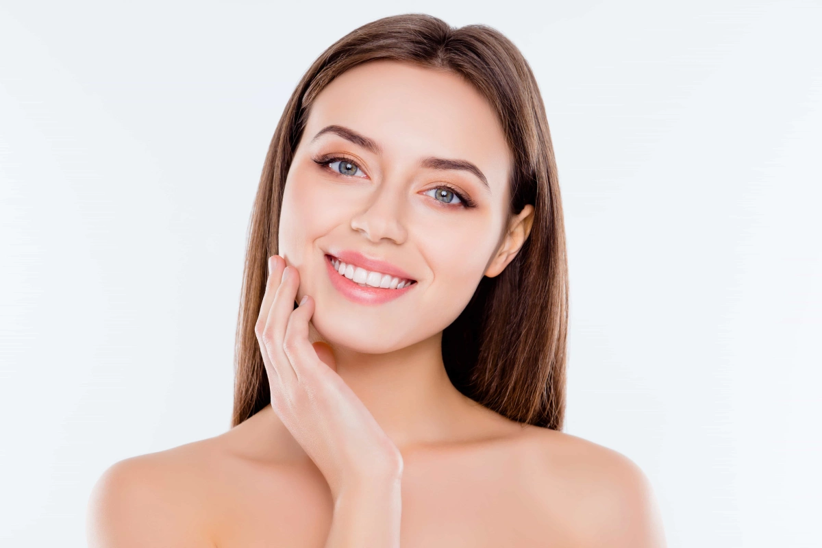 Woman showing reduced chin fullness and a defined jawline after Kybella treatment